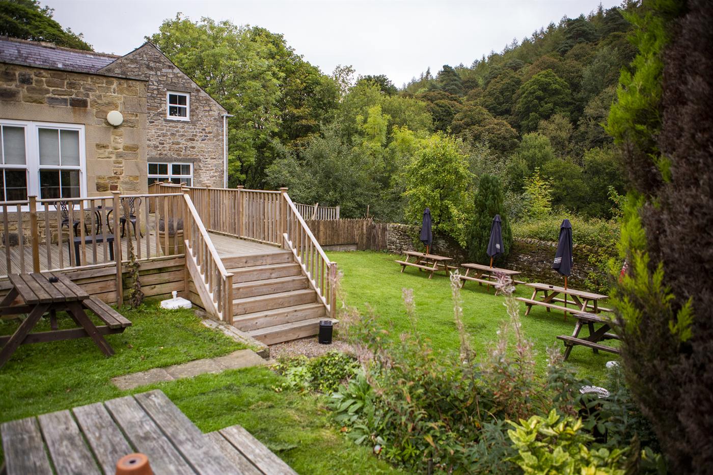 The beer garden with decking, steps and picnic benches