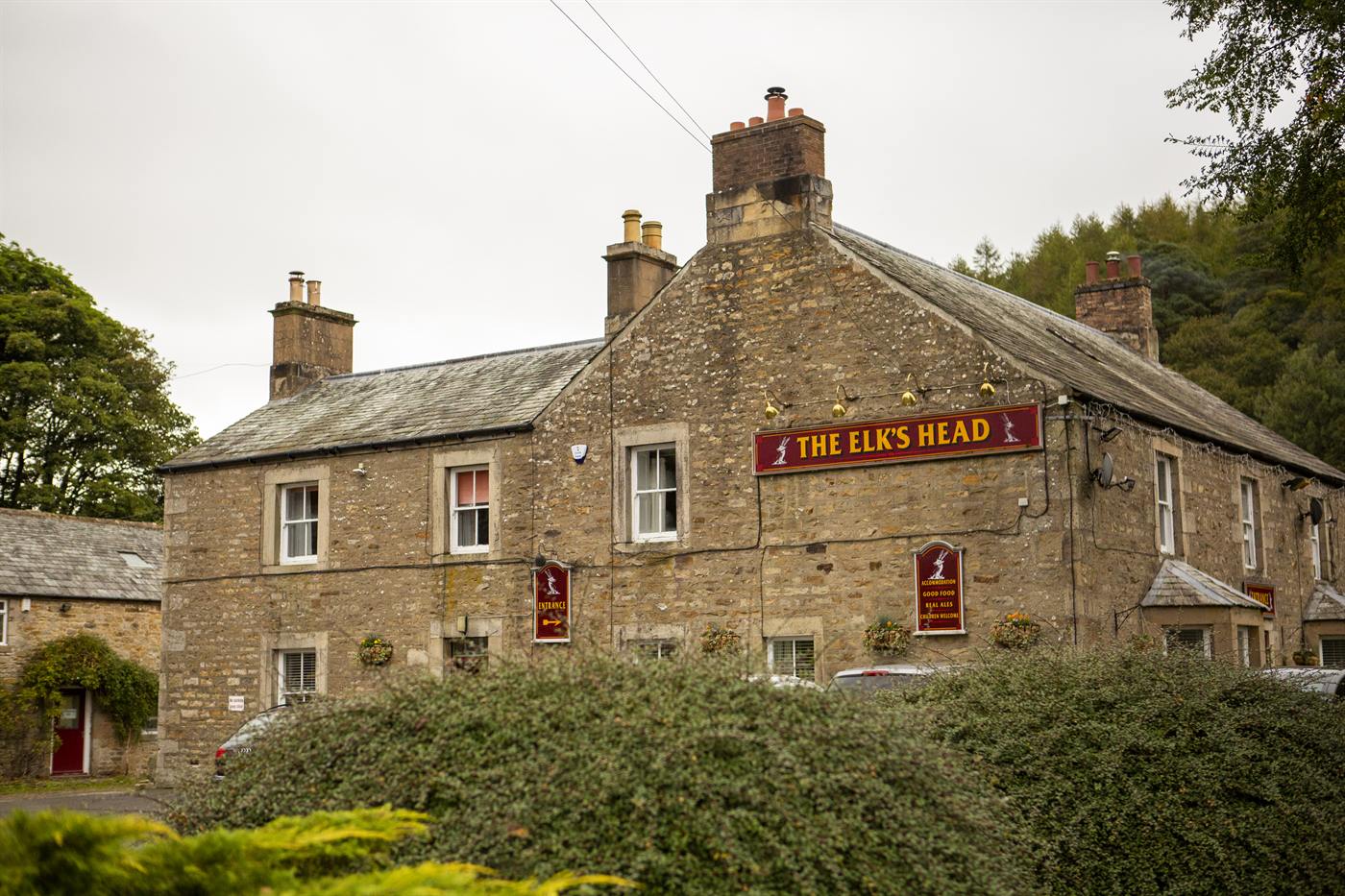 The Elks Head and its sign seen from the road