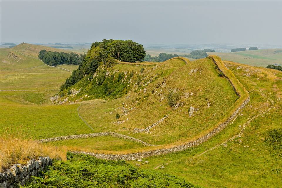 Hadrian's Wall snaking along the top of Housesteads Crags